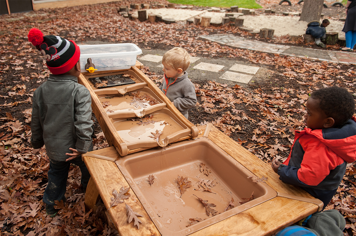 Cummings students play at a water table. Photo: Danen Williams